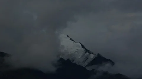 Timelapse Clouds Covering Mountain Peak as Sun Sets in Alaska Stock Footage 121540431