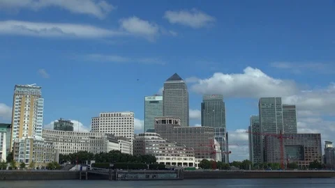 Timelapse clouds cross Canary Wharf financial district in London cruise station Stock Footage 84746261