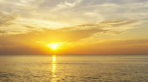Timelapse of clouds crossing the amazing sky over the sea or ocean at sunset. Stock Footage 57659537