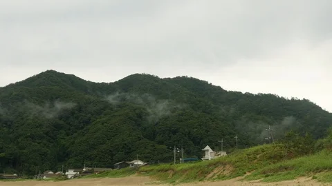 Timelapse of clouds dancing on the mountain in Tottori, Japan, wide Stock Footage 92114312