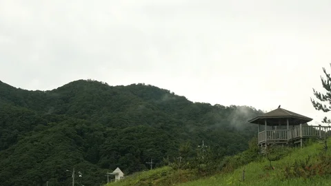 Timelapse of clouds dancing on the mountain in Tottori, Japan, close Stock Footage 92114644