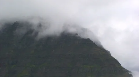 Timelapse of clouds dancing on the top of the fjord Stock Footage 37271664