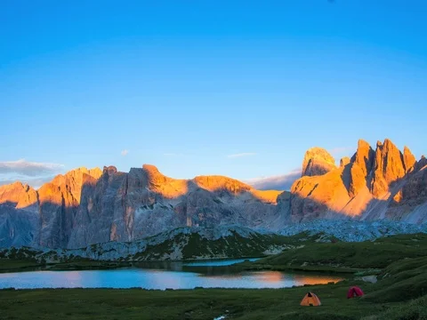 Timelapse of clouds in the Dolomites - Alps. Lake and camping tent. Stock Footage 85040483