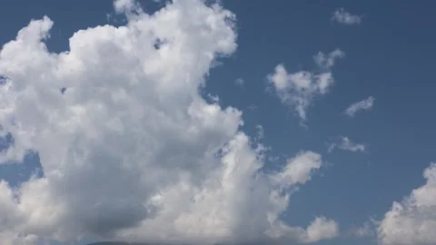 Timelapse of Clouds Drifting Over Mountain Peaks Under Blue Sky Stock Footage 344731466