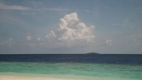 Timelapse of clouds evolving above lonely island Video stock 74696533