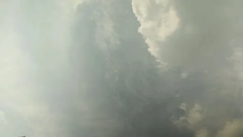 Timelapse of clouds evolving in a dramatic dance, showcasing nature's Stock Footage 274830512