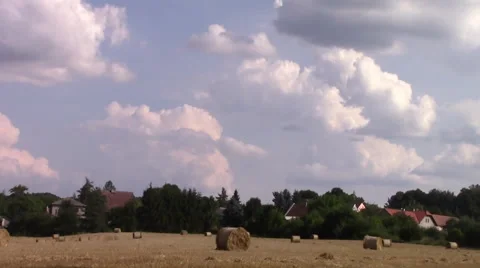 Timelapse clouds field of straw bale Stock Footage 40833944