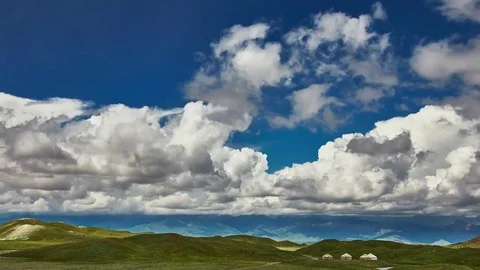 Timelapse. Clouds float above mountains and yurts Stock Footage 70894000