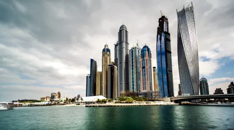Timelapse of clouds floating above Dubai Marina(Cayan Tower), UAE Stock-Footage 64223603