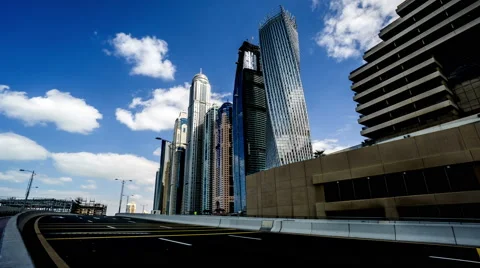 Timelapse of clouds floating above famous Cayan Tower, Dubai, UAE Stock-Footage 64252554