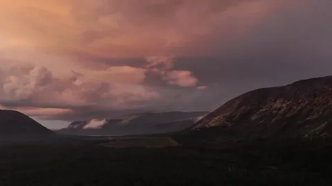 Timelapse of clouds floating in a mountain Stock Footage 225909506