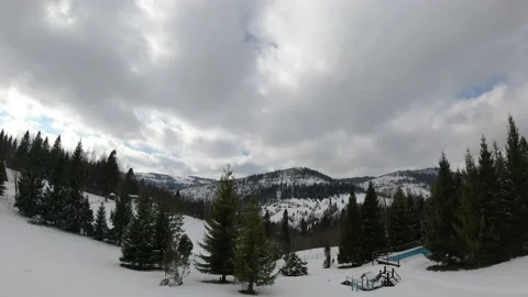 Timelapse clouds floating the sky. Snowed hills and mountains. Winter time. Stock Footage 145757883