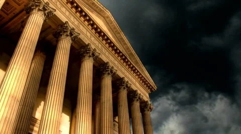 Timelapse clouds flow past historic building Stock Footage 994321