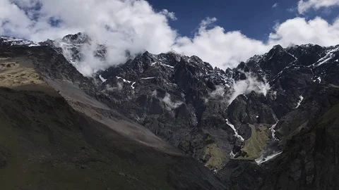 Timelapse of clouds flowing across blue sky over mountains, Georgia, Caucasus. Stock-Footage 115530958