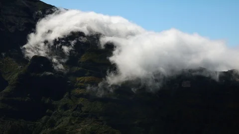 Timelapse of clouds flowing in the mountains Stock Footage 126358346