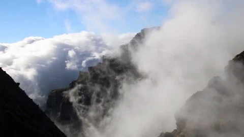 Timelapse of clouds flowing in the mountains Stock Footage 126503829