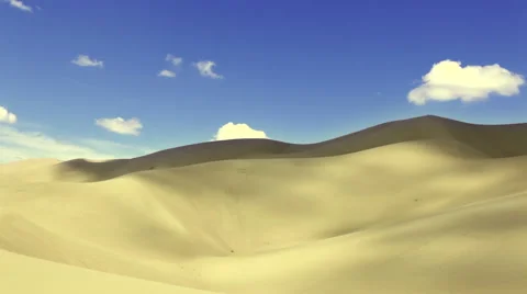 Timelapse: Clouds flowing over desert white sand dunes Stock Footage 44214527
