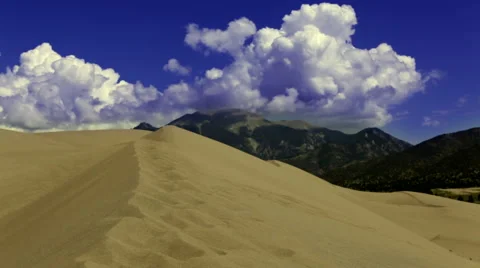 Timelapse: Clouds flowing over sand dunes in desert Stock Footage 44229022