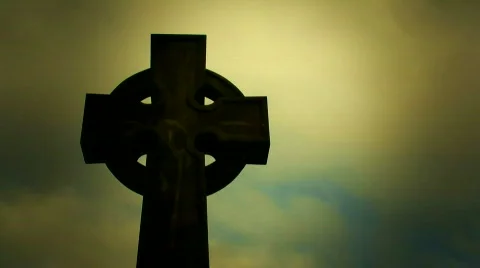 Timelapse clouds flowing past a cross in a cemetery Stock Footage