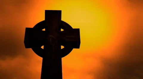 Timelapse clouds flowing past a cross in a cemetery Stock Footage 316731