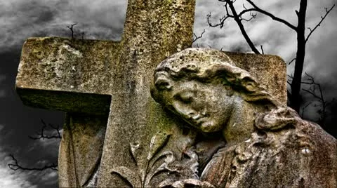 Timelapse clouds flowing past graveyard statue Stock Footage 10608529