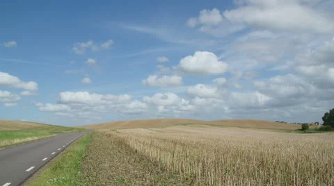 Timelapse clouds flying over field Stock Footage 65822628