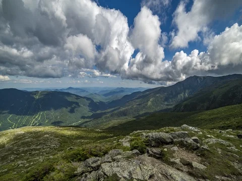 Timelapse of clouds flying over a mountainous landscape Stock Footage 72912686