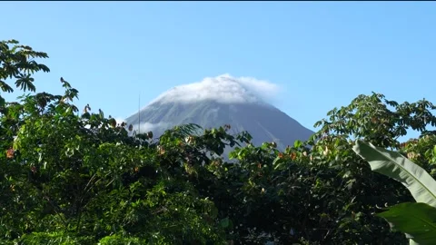 Timelapse Clouds Form Around Arenal Volcano Mountain Peak in Costa Rica. Sl.. Stock Footage 336924024