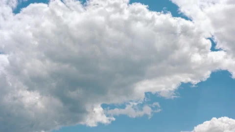 Timelapse of Clouds forming against blue sky Stock Footage 132969760