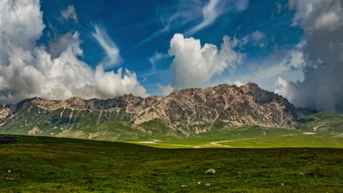 Timelapse of clouds forming and dissolving over the Gran Sasso mountain range Stock Footage 268859420