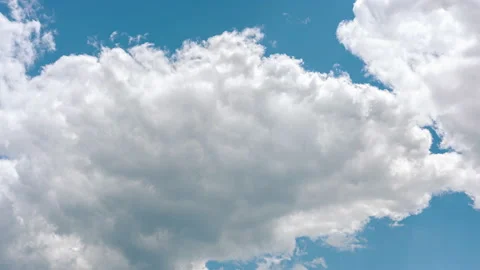 Timelapse of clouds forming in front of a blue sky Stock Footage 132969845