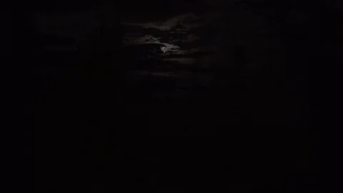 Timelapse of clouds in front of the moon Stock Footage 92367216