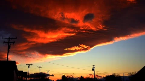 Timelapse of Clouds Glowing with Fiery Orange and Red Highlights 스톡 동영상 327389386