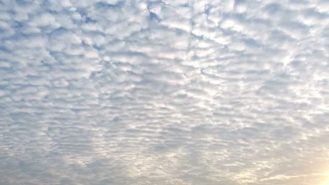 Timelapse clouds gradually turning bright and white as the sunrise appears Video stock 315012028