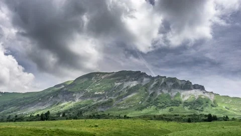 Timelapse - Clouds in a green mountain Stock Footage 165683319