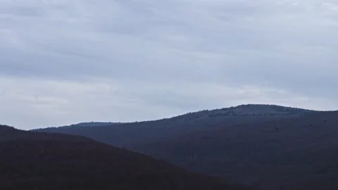 Timelapse of clouds on hilly forests 스톡 동영상 273155002