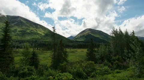 Timelapse of clouds in a lush valley in Alaska Stock Footage 33661784