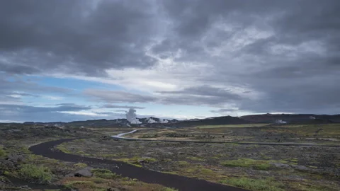 Timelapse of clouds, meadow colors and smoking chimneys in Iceland. Stock Footage 170006296