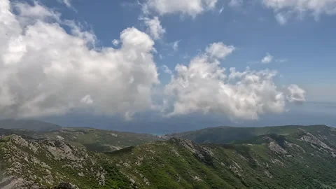 Timelapse. Clouds at mountain height. Clouds moving against the backdrop of m Stock Footage 329550391