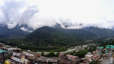 Timelapse clouds in the mountain valley and village Stock Footage 94399599