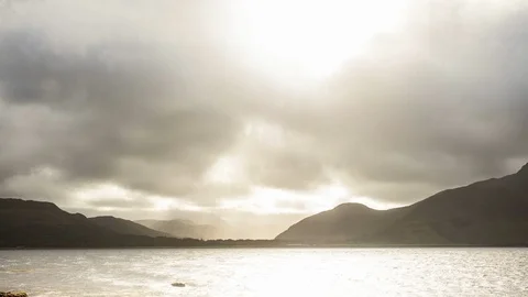 TIMELAPSE CLOUDS MOUTAIN RAY OF LIGHT LOCH SCOTLAND 4K Stock Footage 90631384
