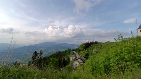 Timelapse clouds move across the sky in the mountains Stock Footage 241794328