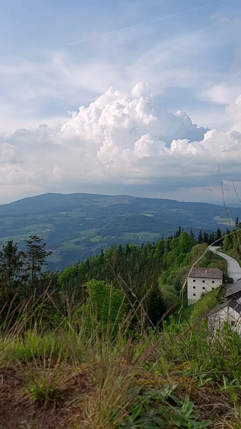 Timelapse clouds move across the sky in the mountains Stock Footage 241794413