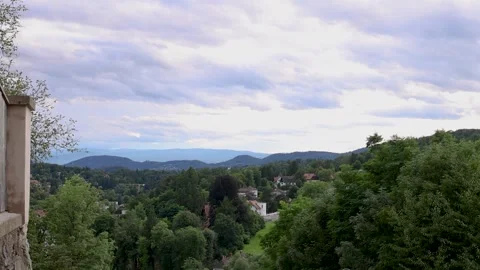 Timelapse clouds move across the sky in the mountains. Houses in the mountains Stock Footage 247507016