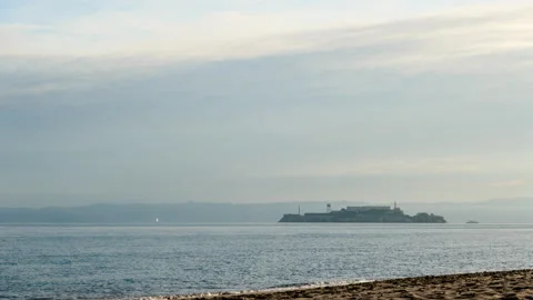 Timelapse clouds move over Alcatraz Island 스톡 동영상 230061756