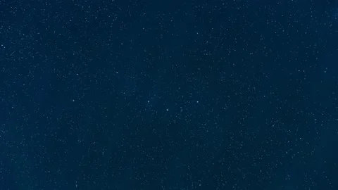 Timelapse of clouds movement in the night sky among the stars Stock Footage 239348439