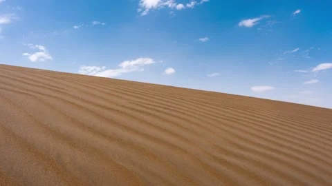 Timelapse of clouds moving above a desert Stock Footage 227786083