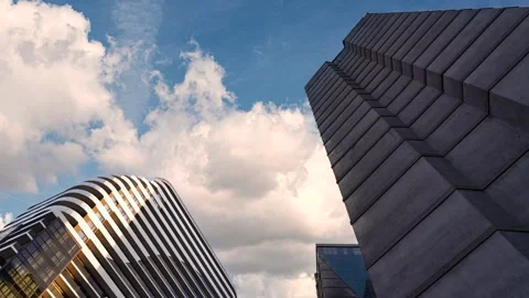 Timelapse of clouds moving above modern skyscrapers Stock Footage 337298124