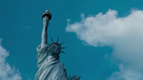 TImelapse of Clouds moving above Statue of Liberty in New York. Stock Footage 145179669