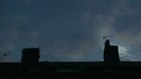 Timelapse clouds moving across chimney tops Stock Footage 311790
